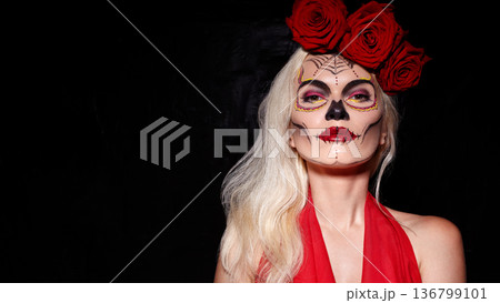 Woman With Sugar Skull Makeup And Red Roses. Mexican holiday Dia de los Muertos. Fashionable Stylish Bright Face Art, Deep Red Roses. Elegant Woman, Vibrant Makeup, Floral Patterns With Crimson Roses 136799101