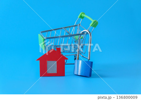 Mini red house and lock on background. Mini red house and lock on background. 136800009