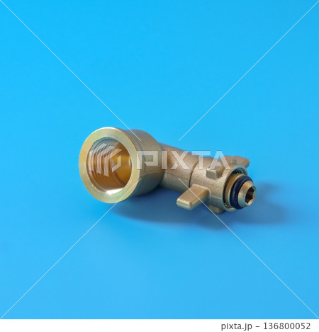 Brass fittings for gas cylinders on color background. Brass fittings for gas cylinders on color background. 136800052