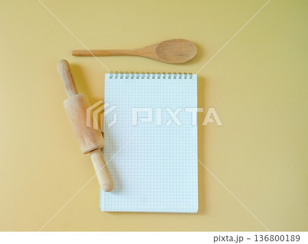 Blank recipe book with rolling pin and spoon. 136800189