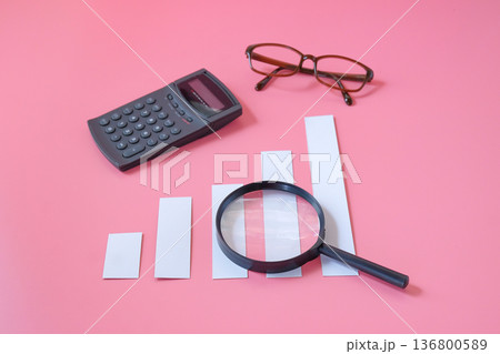 A magnifying glass with charts graphic bar. Financial development. A magnifying glass with charts graphic bar. Financial development. 136800589