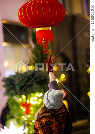 Celebrating culture with vibrant lanterns and festive lights during winter evenings 136802010