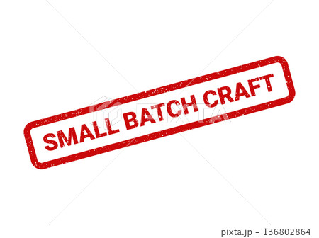 Distressed red rubber stamp illustration featuring the text SMALL BATCH CRAFT inside its rectangular frame, celebrating artisanal and handmade production 136802864