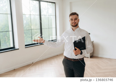 Real estate agent is in the new room Real estate agent is in the new room 136803746
