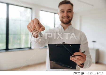 Real estate agent is in the new room Real estate agent is in the new room 136803754