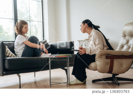 Talking about problems. Girl at a psychologist's appointment Talking about problems. Girl at a psychologist's appointment 136803765