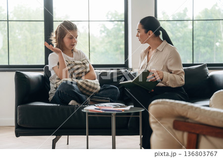 Talking about problems. Girl at a psychologist's appointment Talking about problems. Girl at a psychologist's appointment 136803767