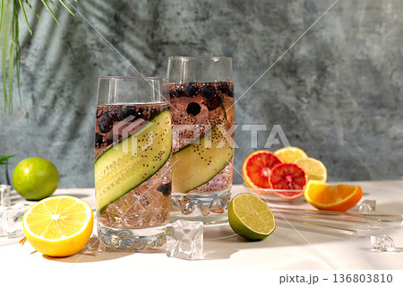 Diet vegan cocktail with cucumber, lemon, lime, blueberry and chia seeds, detox diet and weight loss concept, healthy lifestyle and healthy food advertising, cafe menu. Modern still life with drinks. 136803810