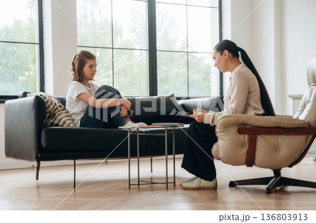 Talking about problems. Girl at a psychologist's appointment 136803913