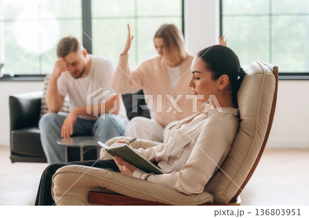 Arguing, feeling bad. Couple are at psychologist appointment Arguing, feeling bad. Couple are at psychologist appointment 136803951