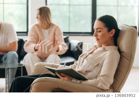 Arguing, feeling bad. Couple are at psychologist appointment Arguing, feeling bad. Couple are at psychologist appointment 136803952
