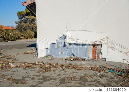 Broken Beach House Wall with Storm Debris 136804030