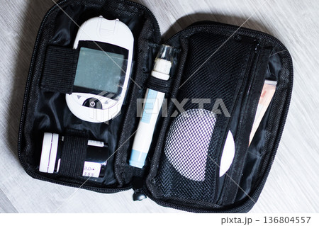 Home glucose meter setup scene. Digital glucose testing device with accessories displayed 136804557