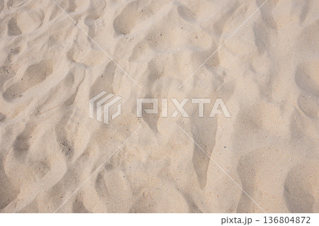 Wave on the yellow sand near the water. Sea beach. Nature background. Wave on the yellow sand near the water. Sea beach. Nature background. 136804872