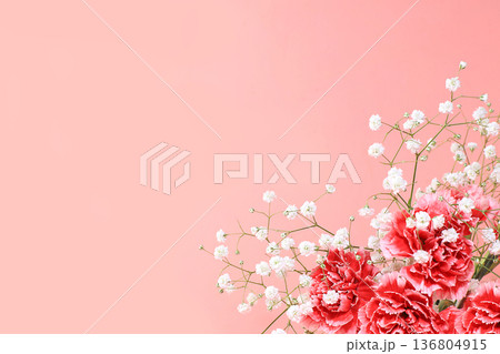 Abstract floral composition, spring background. Carnations on pink background, minimal holiday concept. Postcard for womens day or mothers day, happy birthday, wedding, banner for the screen, 136804915