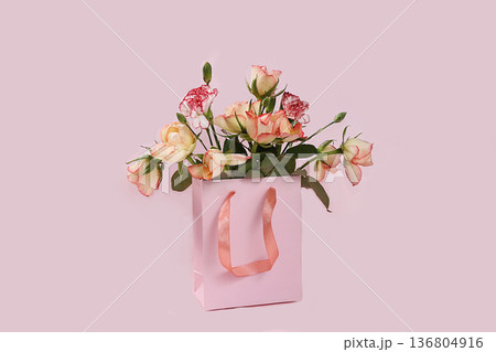 Flowers in a pink box, abstract spring floral background, banner. Creative modern bouquet, minimal holiday concept. Greeting card for mother's day, womens day, happy birthday, Flowers in a pink box, abstract spring floral background, banner. Creative modern bouquet, minimal holiday concept. Greeting card for mother's day, womens day, happy birthday, 136804916