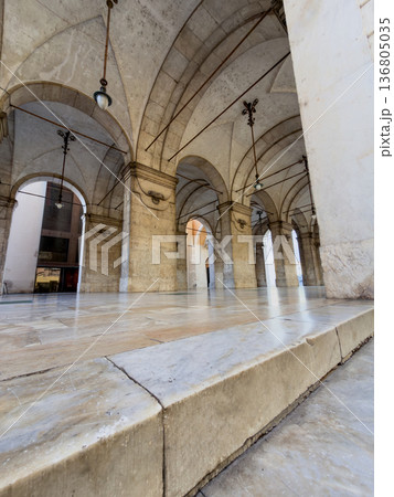 Elegant Vaulted Arcade Reflecting Warm Glow On Smooth Stone Surfaces Elegant Vaulted Arcade Reflecting Warm Glow On Smooth Stone Surfaces 136805035