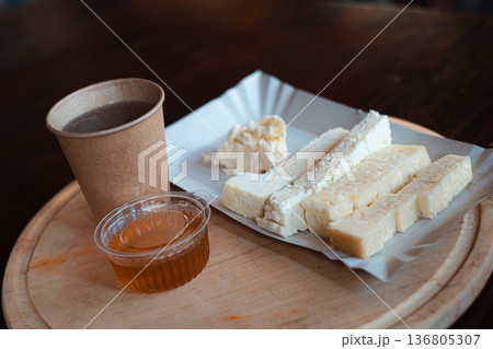 Traditional Cheese and Honey Snack with Hot Drink 136805307