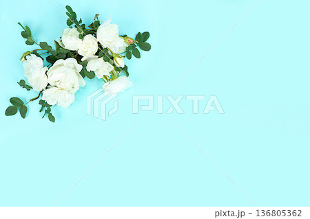 Beautiful roses on a light background with space for text.Abstract floral composition, hello spring concept, template for design, still life with flowers for holiday, selective focus. 136805362