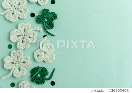 Crocheted Four Leaf Clovers with Sequins.  Saint Patricks Day Decorative Background 136805408