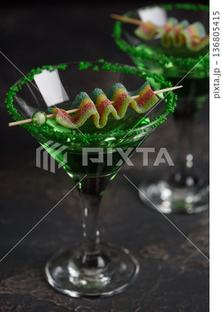 Green Cocktails with Rainbow Candy and Shamrocks. Festive St. Patricks Day Celebration Still Life Green Cocktails with Rainbow Candy and Shamrocks. Festive St. Patricks Day Celebration Still Life 136805415