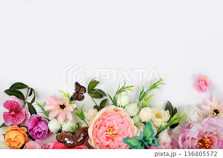 Beautiful flowers and butterflies on a light background.Abstract floral composition, still life, spring background or banner, holiday concept. Card for Mother's Day, Women's Day, Happy Birthday, Beautiful flowers and butterflies on a light background.Abstract floral composition, still life, spring background or banner, holiday concept. Card for Mother's Day, Women's Day, Happy Birthday, 136805572