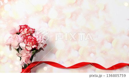 Greeting card for Women's Day or Valentine's Day. Red carnations on abstract blurred background with bokeh. March 8 festive background, place for text, banner. Happy birthday, wedding. Spring holiday Greeting card for Women's Day or Valentine's Day. Red carnations on abstract blurred background with bokeh. March 8 festive background, place for text, banner. Happy birthday, wedding. Spring holiday 136805759