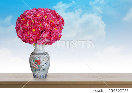 front view beautiful red and pink roses and flowers and yellow pollen bouqurt on white ceramic vase on wooden floor, white and blue sky background, banner, template, name card, love, valetine, copy 136805788