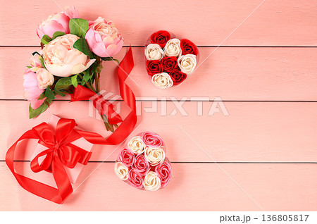 Beautiful rose flowers in a box with a heart.gift and bouquet on a light background. Abstract flower arrangement, spring background or banner, holiday concept. Card for Mother's Day, Wedding, Beautiful rose flowers in a box with a heart.gift and bouquet on a light background. Abstract flower arrangement, spring background or banner, holiday concept. Card for Mother's Day, Wedding, 136805817