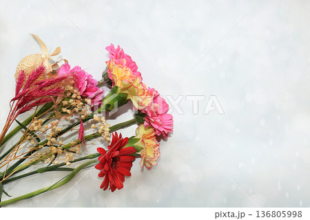Beautiful flowers and butterflies on a light background.Abstract floral composition, still life, spring background or banner, holiday concept. Card for Mother's Day, Women's Day, Happy Birthday, 136805998