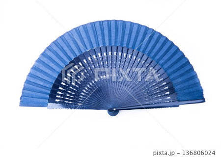 Open dark blue fan on white isolated background. 136806024