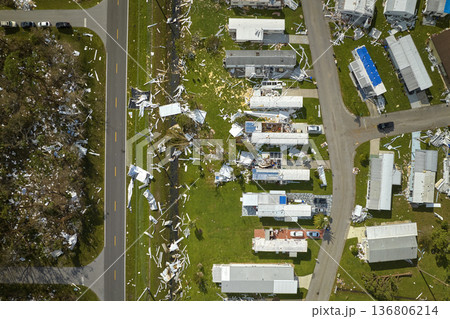 Destroyed by hurricane Ian suburban houses in Florida mobile home residential area. Consequences of natural disaster 136806214