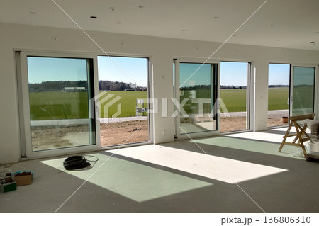 Interior of a house with big room under renovation works. Interior of a house with big room under renovation works. 136806310