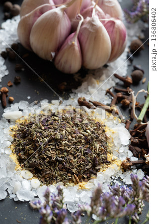 seasonings background with salt, Spices  and garlic served  at black. natural meal additives. healthy food concept. macro shot 136806402