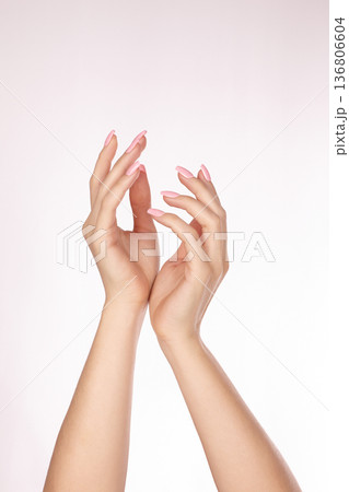 Soft Pink Manicured Hands Elegantly Raised Showcasing Slender Fingers Glossy Oval Nails Smooth Skin Delicate Pose, Grace, Femininity Clean Pastel Beauty For Nail Care, Manicure, Nails Polish 136806604