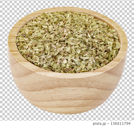Dried oregano leaves in a small wooden bowl isolated. Useful for culinary, cooking, spice, and herb concepts. High-quality seasoning ingredients for food photography. 136811794