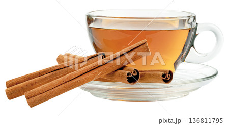 Aromatic tea in clear glass cup with saucer and cinnamon sticks isolated. Healthy organic herbal drink concept for wellness. Professional macro food photography in clean style. Aromatic tea in clear glass cup with saucer and cinnamon sticks isolated. Healthy organic herbal drink concept for wellness. Professional macro food photography in clean style. 136811795