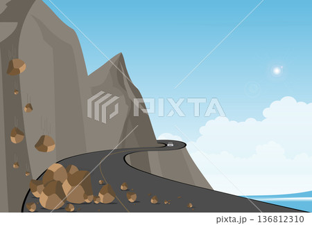 Winding mountain road along a cliff with fallen rocks on the road. 136812310