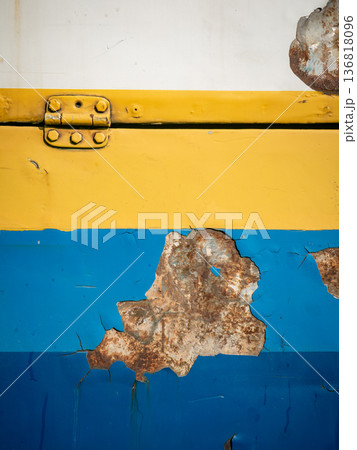 Peeling Paint on Old Metal Surface with Yellow Hinge and Rust Damage Peeling Paint on Old Metal Surface with Yellow Hinge and Rust Damage 136818096