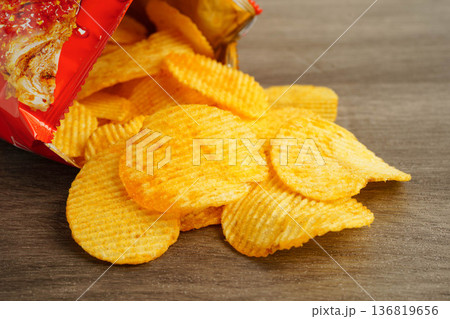 Potato chips , delicious BBQ seasoning spicy for crips, thin slice deep fried snack fast food. Potato chips , delicious BBQ seasoning spicy for crips, thin slice deep fried snack fast food. 136819656