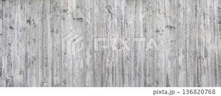 Gray concrete wall showing weathered wood grain texture Gray concrete wall showing weathered wood grain texture 136820768