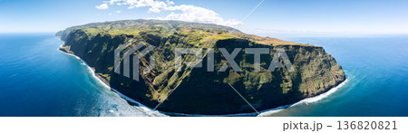 Aerial panorama shows Ponta do Pargo cliffs with green plateau above sheer Atlantic walls below Aerial panorama shows Ponta do Pargo cliffs with green plateau above sheer Atlantic walls below 136820821