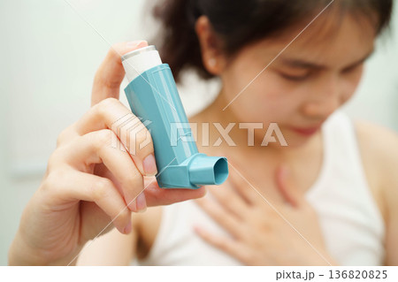 Asthma and chronic obstructive pulmonary disease COPD, Asian teenage using metered dose inhaler MDI. Asthma and chronic obstructive pulmonary disease COPD, Asian teenage using metered dose inhaler MDI. 136820825