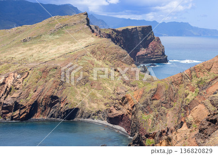 From Sao Lourenco trail Baia d Abra bay curves past basalt layers and red terraces with waves From Sao Lourenco trail Baia d Abra bay curves past basalt layers and red terraces with waves 136820829