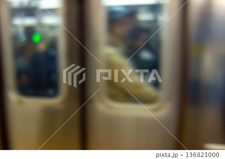 Defocused motion blur closeup crowded MTA subway car doors copy space NYC 136821000