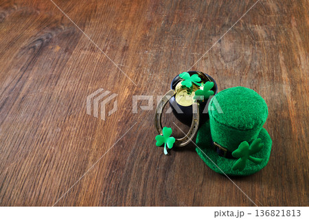 St. Patrick's day leprechaun hat and pot of gold symbolizing irish luck St. Patrick's day leprechaun hat and pot of gold symbolizing irish luck 136821813