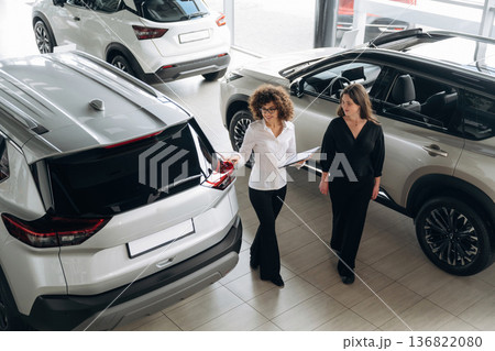 Retail shop worker is helping the customer Retail shop worker is helping the customer 136822080