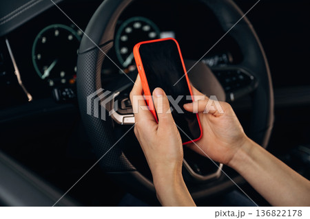 Close up view of woman that is sitting in the car Close up view of woman that is sitting in the car 136822178