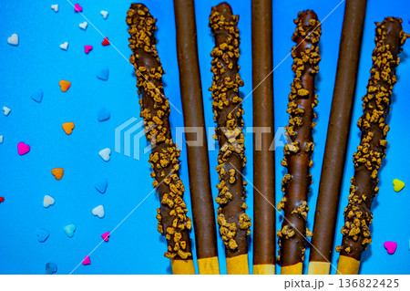 Dropped in chocolate a stick cookie Pepero. November 11th is Pepero Day in Korea 136822425
