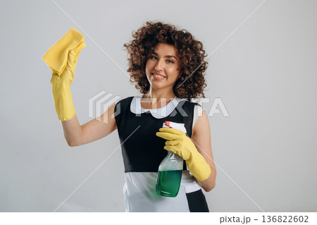 Cleaning the home conception, in yellow protective gloves. Beautiful woman is in the studio Cleaning the home conception, in yellow protective gloves. Beautiful woman is in the studio 136822602
